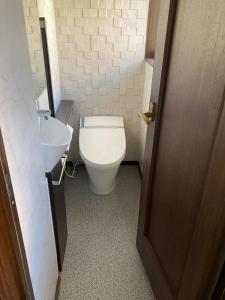 a bathroom with a toilet and a sink at A Beautiful Large Japanese Home with Tatami room in Shizuoka +15 photos