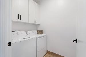 a white laundry room with a washer and dryer at Desert Oasis Close to Zion Pool and Hot Tub in Kanab +31 photos