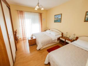 Posteľ alebo postele v izbe v ubytovaní Hotel Adria