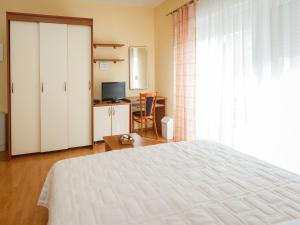 Posteľ alebo postele v izbe v ubytovaní Hotel Adria