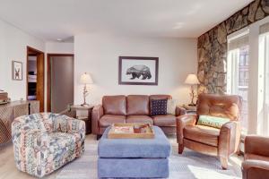 a living room with a couch and a chair at E101 Lake Cliffe condo in Dillon