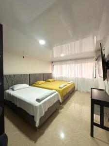 Postel nebo postele na pokoji v ubytování Casa Los Almendros, Casa Completa