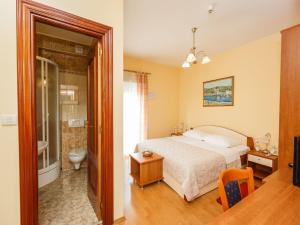 Posteľ alebo postele v izbe v ubytovaní Hotel Adria