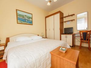 Posteľ alebo postele v izbe v ubytovaní Hotel Adria