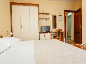 Posteľ alebo postele v izbe v ubytovaní Hotel Adria