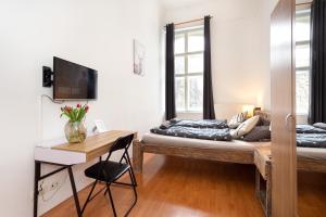 Posteľ alebo postele v izbe v ubytovaní Cedar Inn Budapest - Palace District