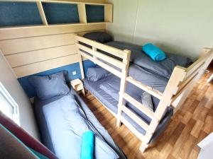Postel nebo postele na pokoji v ubytování Luxuriöses Mobile Home beim Europa Park Rulantica