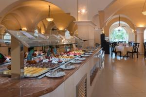 a buffet line with many different types of food at Occidental Caribe - All Inclusive in Punta Cana