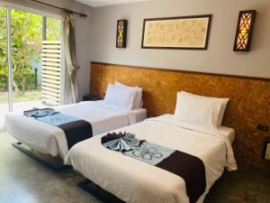 Postelja oz. postelje v sobi nastanitve The Hip Resort @ Phi Phi