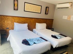 Postelja oz. postelje v sobi nastanitve The Hip Resort @ Phi Phi