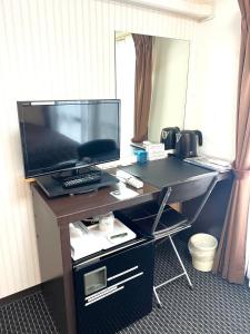 TV a/nebo společenská místnost v ubytování Business Inn Sennichimae Hotel