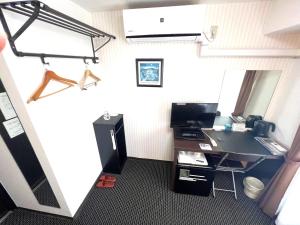 TV a/nebo společenská místnost v ubytování Business Inn Sennichimae Hotel