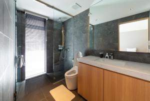 a bathroom with a sink and a toilet at Mori Casa in Kutchan +23 photos