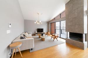 a living room with a couch and a fireplace at Mori Casa in Kutchan