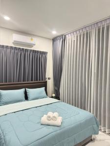 Postel nebo postele na pokoji v ubytování Moon Nine Village Khao Yai