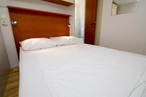 Postel nebo postele na pokoji v ubytování Camp Sibuljina