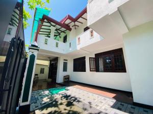 a view from the inside of a house with a courtyard at Jayamal Piyasa Apt in Ambalangoda