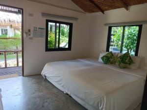 Postel nebo postele na pokoji v ubytování Sarana Bungalows