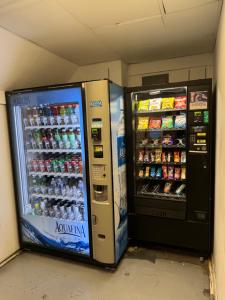 two vending machines are sitting next to each other at Castle beach studio,tennis court and swimming pool with beach access in Miami Beach