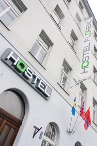 a building with a sign on the side of it at Hostel Florenc in Prague
