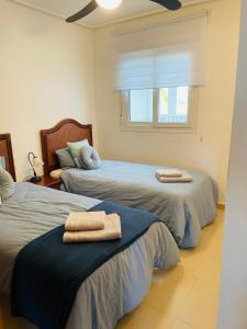 two beds in a room with towels on them at Casa Serena - Sucina in Sucina +37 photos
