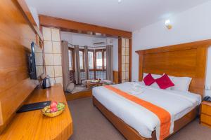 Postel nebo postele na pokoji v ubytování Amber Royel Hotel + 37 fotografií