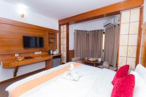 Voodi või voodid majutusasutuse Amber Royel Hotel toas