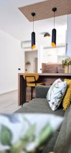 a living room with a couch and a table at GREEN cozy apartment with shared POOL in Split