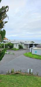 a building with a road in front of it at 10 Coral Cove Beach Lodge in Ballito