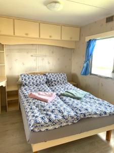 Letto o letti in una camera di Mobilheim Stella - Výrovická přehrada