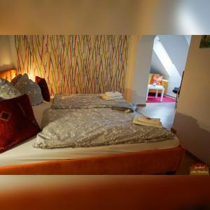 Postel nebo postele na pokoji v ubytování Hotelpension Pfarrhaus