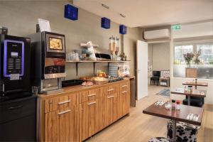 Kuchyň nebo kuchyňský kout v ubytování Hotel Victorie + 31 fotografií