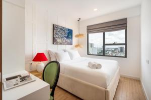 Postel nebo postele na pokoji v ubytování SOHO Residence & Hotel + 40 fotografií
