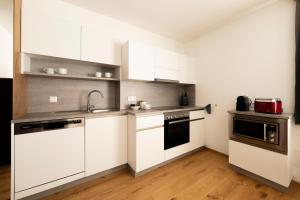 Kuchyňa alebo kuchynka v ubytovaní Apartments Hohenberger Mallnitz - Mein Platz in den Bergen!