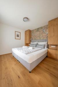 Posteľ alebo postele v izbe v ubytovaní Apartments Hohenberger Mallnitz - Mein Platz in den Bergen!
