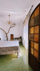 a bedroom with a bed and a window at La Casa del Grillo in Viterbo