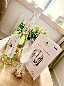 two bottles of wine sitting on top of a table at Central Park Lublin in Lublin