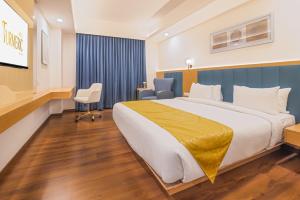 Postel nebo postele na pokoji v ubytování Hotel Turmeric