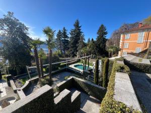a house with a swimming pool in a yard at Relais Villa Margherita in Oggebbio