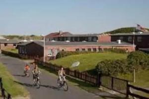 a group of people riding motorcycles down a road at Gutenbergheim Wangerooge in Wangerooge
