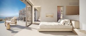 a bedroom with a bed and a balcony at Vouno in Pirgos