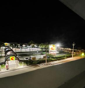 a view of a street at night with a gas station at Elements Residence Samui in Koh Samui  +2 photos