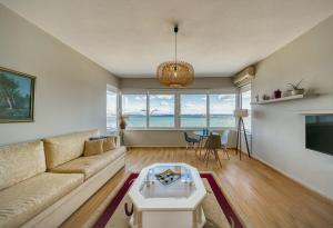 a living room with a couch and a table at Faros in Chios