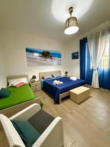 Postel nebo postele na pokoji v ubytování B&B Nonna Olga