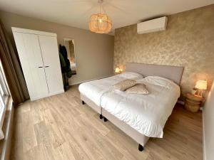En eller flere senge i et værelse på Sealoft appartement Vrouwenpolder