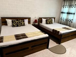 Postel nebo postele na pokoji v ubytování Home Living Unit