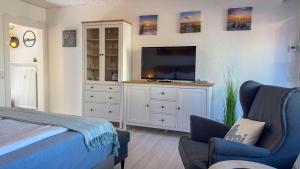 Μια τηλεόραση ή/και κέντρο ψυχαγωγίας στο Meehrblick Alte Liebe