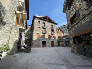 an empty alley in an old stone building at Villmor - B23 - Corazón del Casco in Benasque