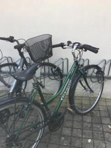 a group of bikes parked next to a wall at Le Bulot Bleu *Terrasse couverte *Parking *2 vélos in Carnac