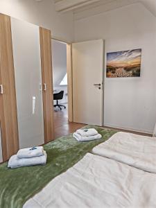 Katil atau katil-katil dalam bilik di Stylische DG-Wohnung, Kinder willkommen